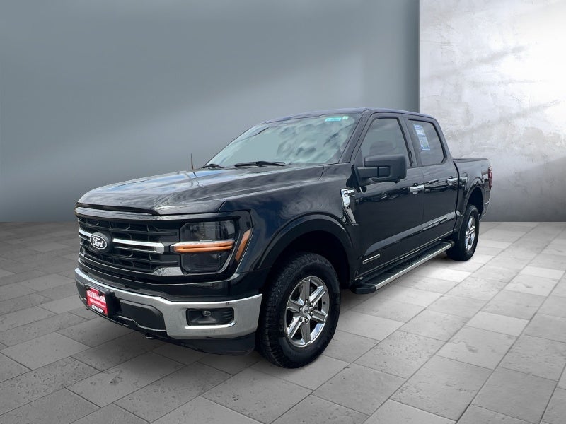 2024 Ford F-150 XLT in Agate Black Metallic — front three-quarter view