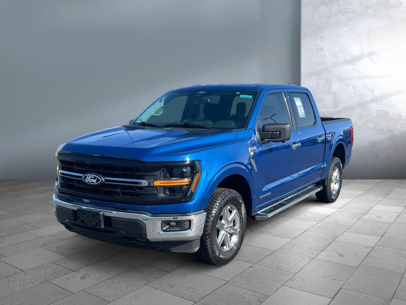 2024 Ford F-150 XLT in Atlas Blue Metallic — front three-quarter view
